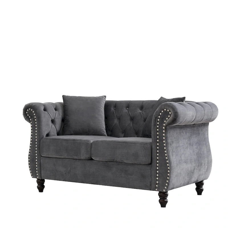 Causeuse chesterfield en velours, accoudoirs arrondis, garniture cloutée