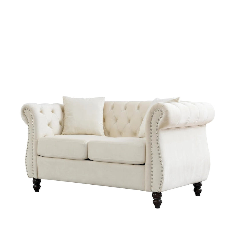 Causeuse chesterfield en velours, accoudoirs arrondis, garniture cloutée