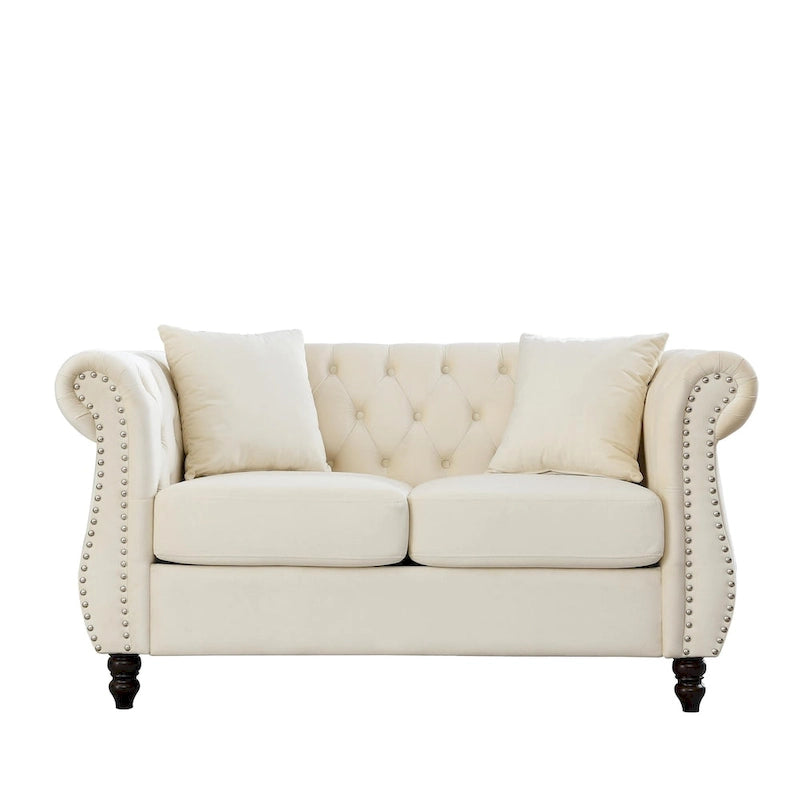 Causeuse chesterfield en velours, accoudoirs arrondis, garniture cloutée